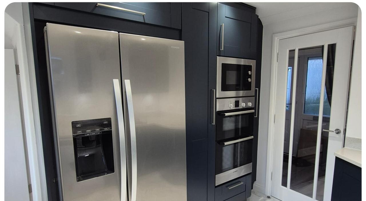 Oak kitchen → Deep navy respray — after