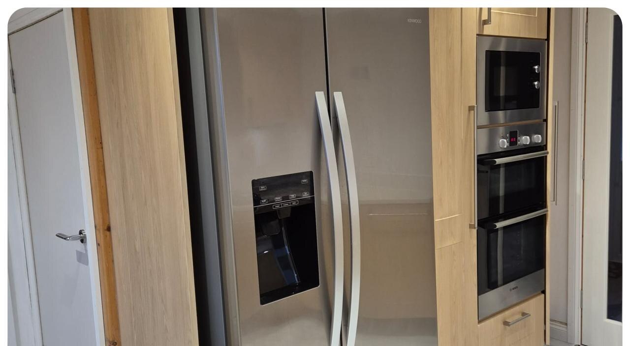 Oak kitchen → Deep navy respray — before