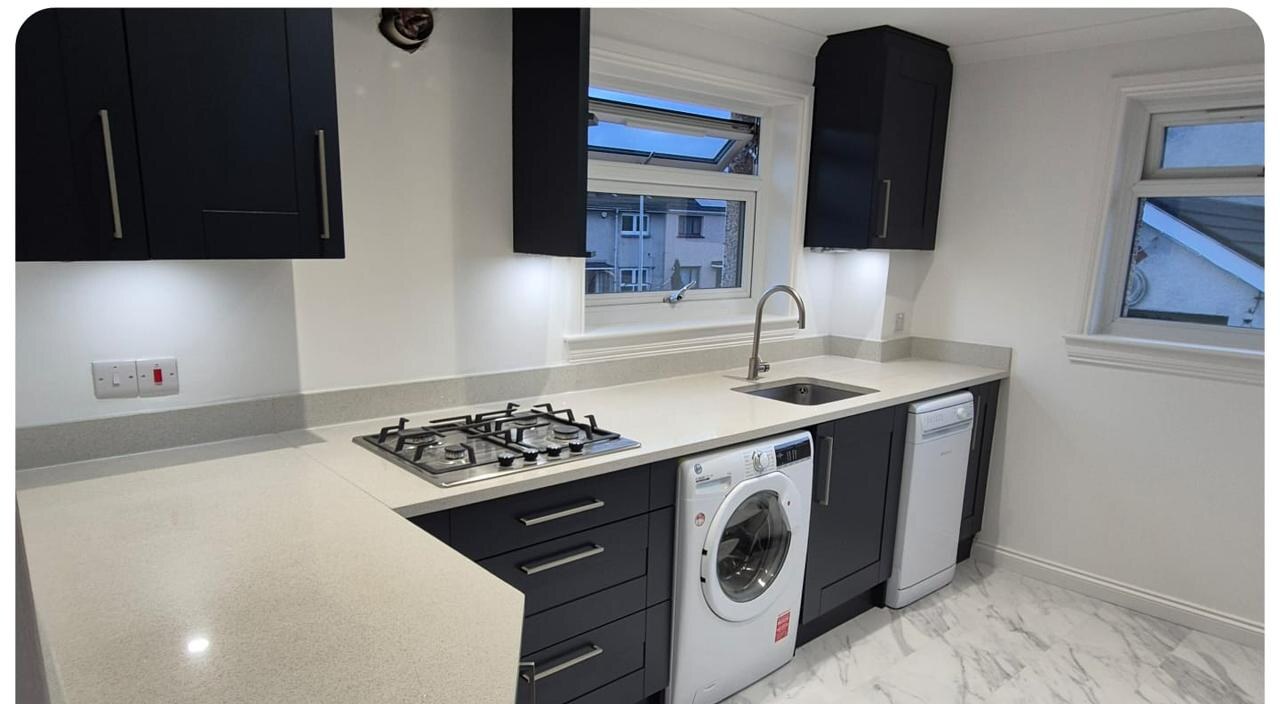Bare cabinets → Modern matte navy — after